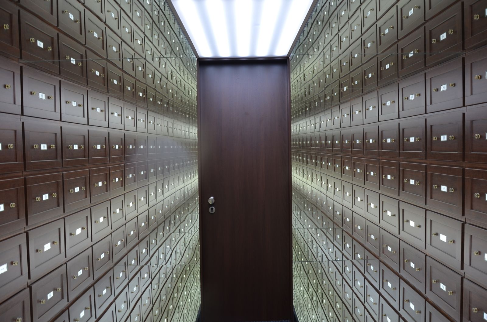 A secure vault lined with rows of safety-deposit boxes