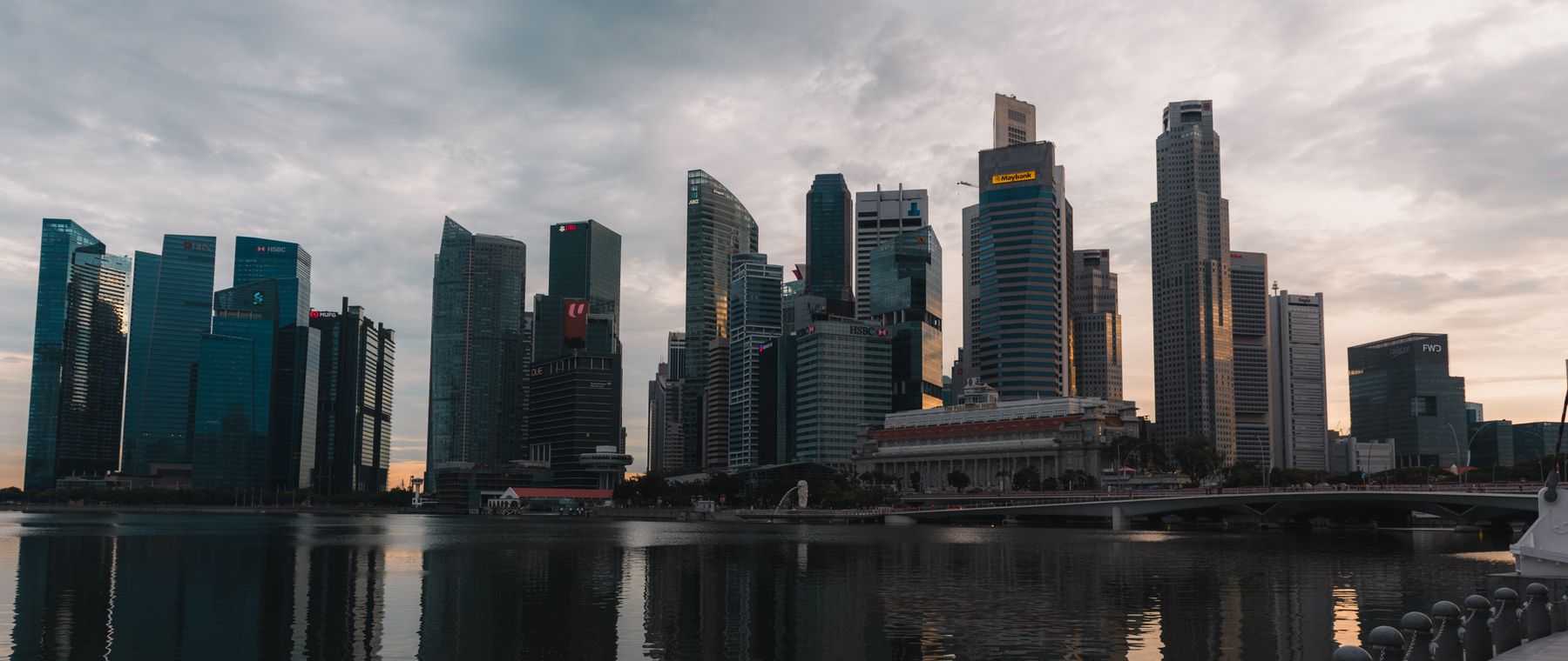 A modern financial-district skyline at dusk