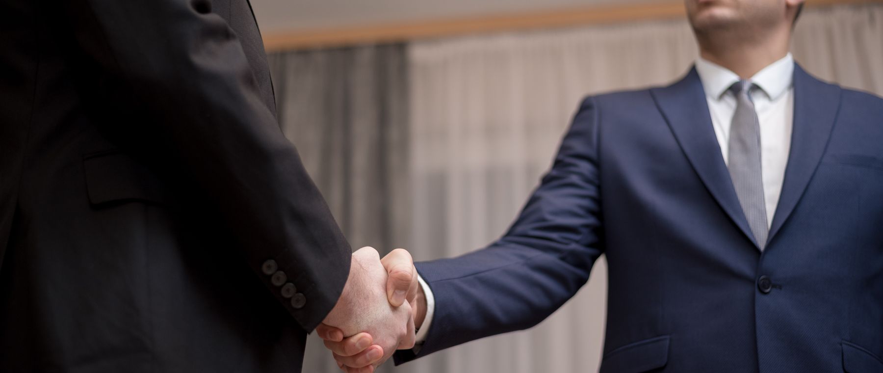 Two business partners shaking hands