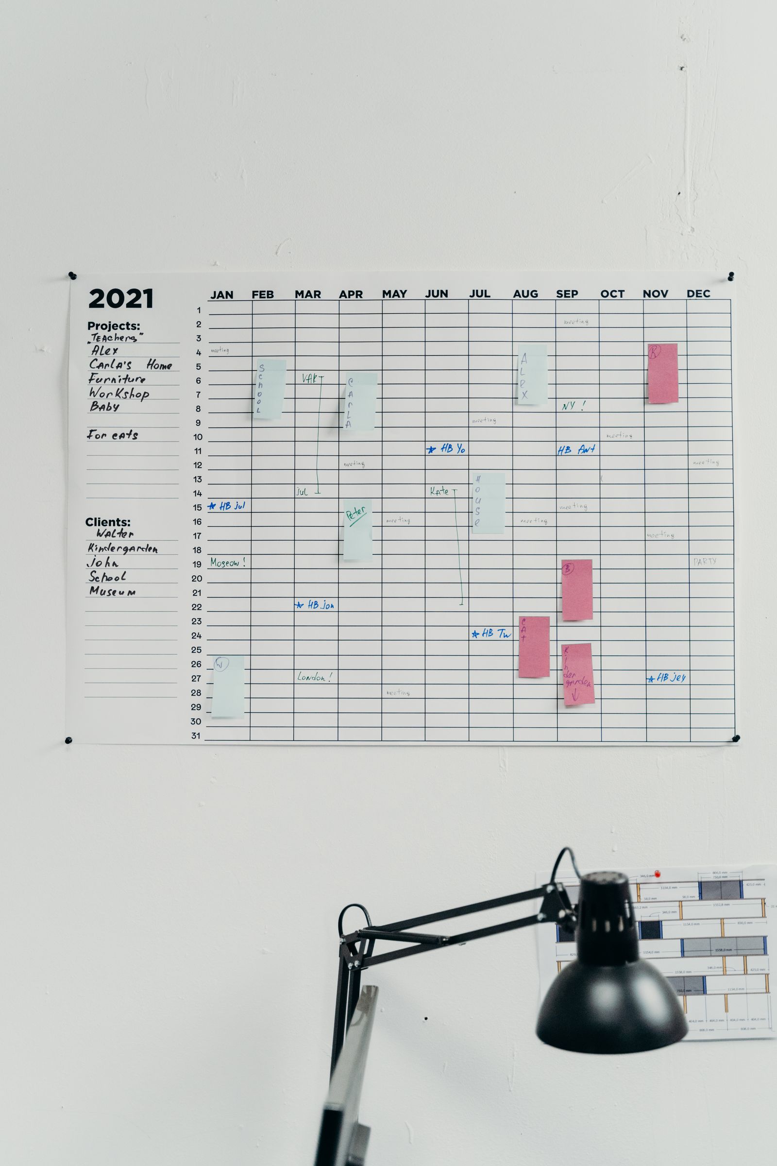 A wall planner marked up with scheduled dates