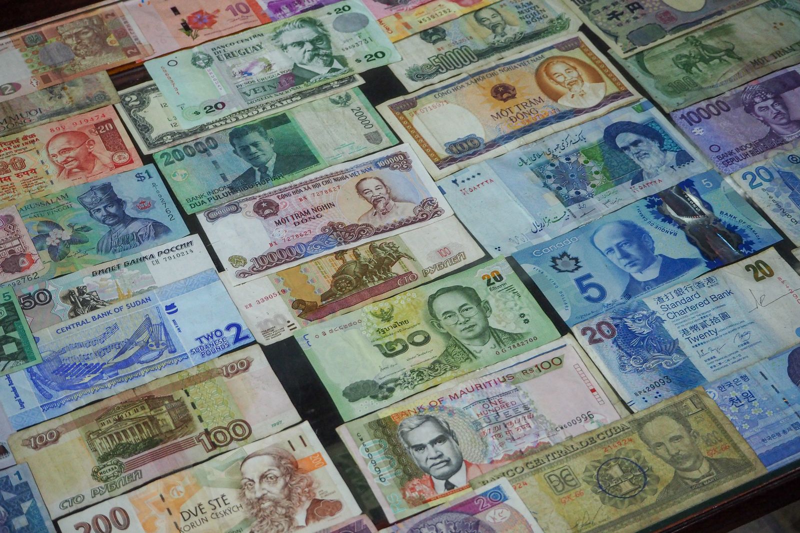 Banknotes from currencies around the world laid out in a row