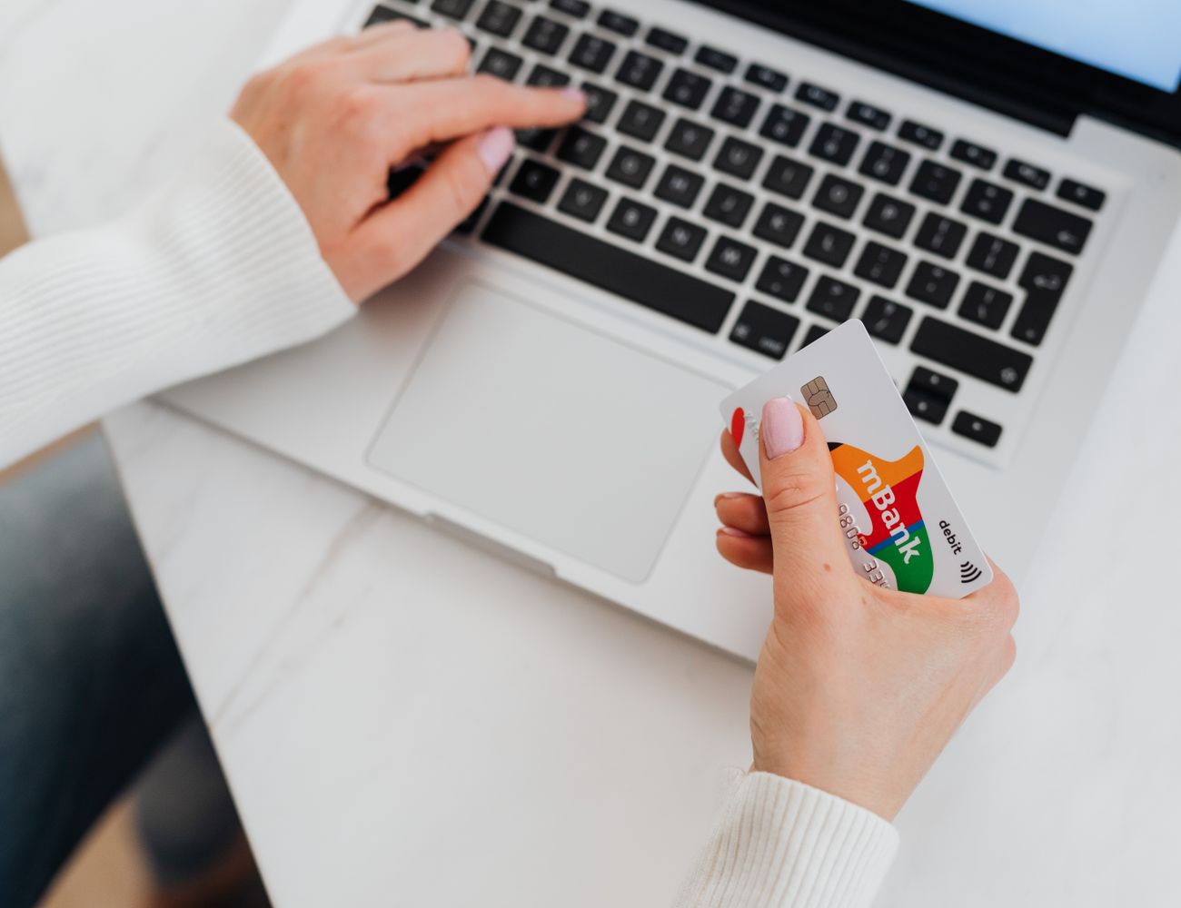 Paying online with a card and a laptop